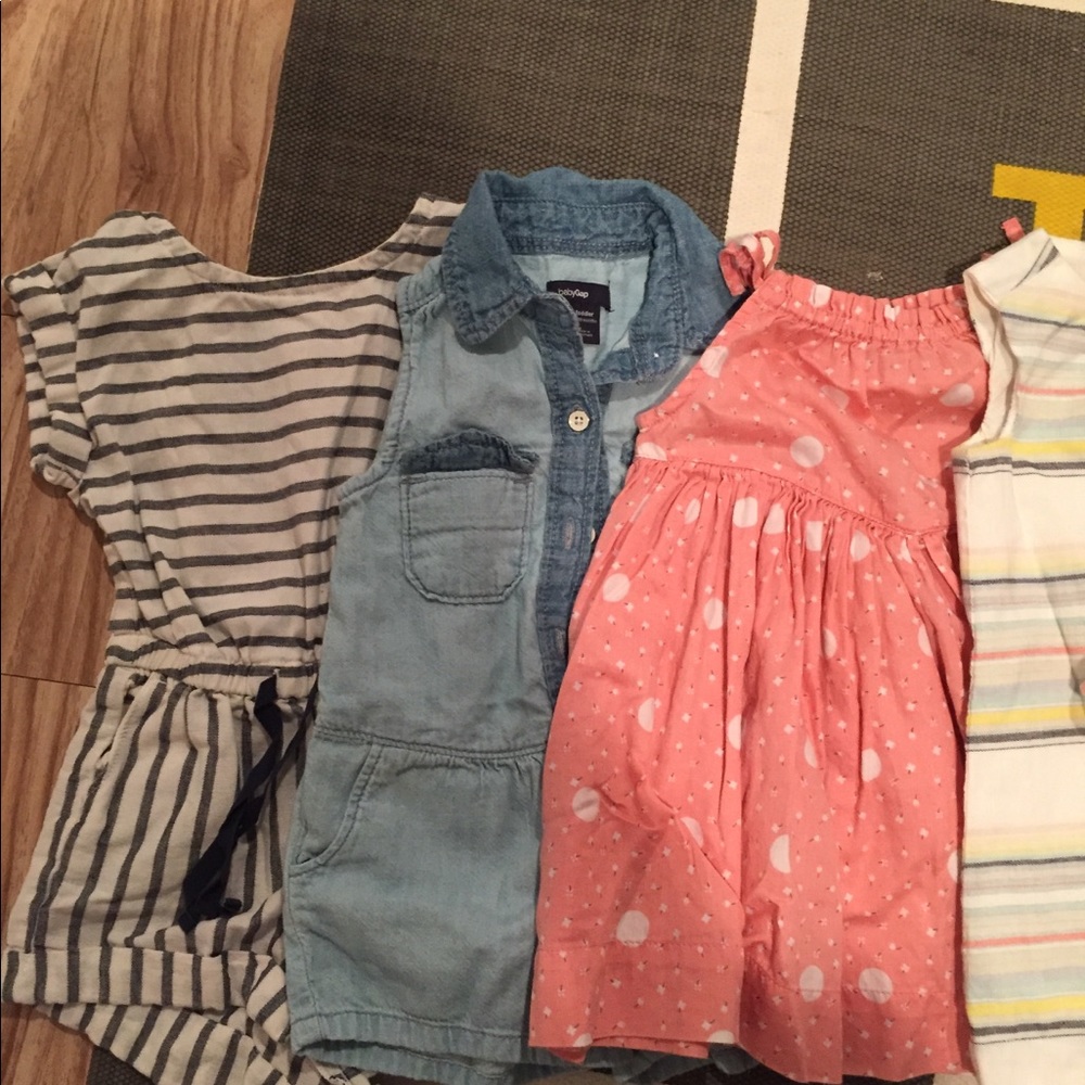 Mix of baby girl rompers and dresses
